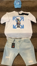 White t-shirt with graphic design, light blue shorts, and blue cap on a brown surface